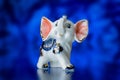 Porcelain statuette, porcelain statuette of the elephant on a blue background Royalty Free Stock Photo