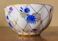 Porcelain sugar bowl, cup, milk, dish with golden pattern and blue flowers. Royalty Free Stock Photo