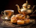 Porcelain teapot, cup of tea and biscuits served on elegant plate, creating cozy and inviting atmosphere Royalty Free Stock Photo