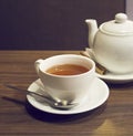 Porcelain teapot, teacup, spoon and Royalty Free Stock Photo