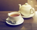 Porcelain teapot, teacup, spoon and canella Royalty Free Stock Photo