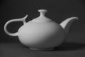 Porcelain teapot, white ceramic for brewing tea. Black and white