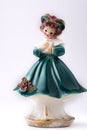 Porcelain Vintage girl figurine with prayer book in blue dress and brown hair