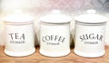 Porcelain white jars for tea, sugar and coffee Royalty Free Stock Photo