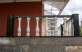 Porch with black railing and white twisted posts. The old porch Royalty Free Stock Photo