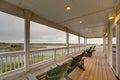 Porch chairs overlooking the sound lights grass Royalty Free Stock Photo