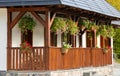 Porch with flowers in an old peasant house. Royalty Free Stock Photo
