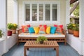 porch with wooden benches and colorful cushions