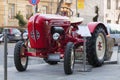 Porsche Junior tractor parked in front of a hotel