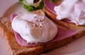 Porched egg on top of ham and toast. Royalty Free Stock Photo