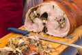 Porchetta, traditional italian roasted pork display in a country