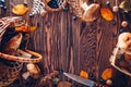 Porcini mushrooms in basket with berries and nuts on wooden table. Autumn harvest. Gathered fall crop. Space Royalty Free Stock Photo