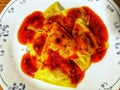 Porcini ravioli with marinara sauce Royalty Free Stock Photo