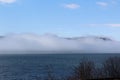 Porcupine Mountain at the entrance of Cape Breton Island looking across the strait of Canso covered in fog Royalty Free Stock Photo
