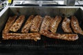 Pork baby ribs on a barbecue grill Royalty Free Stock Photo