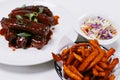 Pork baby ribs glazed with barbecue sauce, with sweet potato fries and coleslaw salad Royalty Free Stock Photo