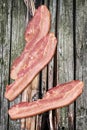 Pork Bacon Rashers Set On Old Knotted Weathered Cracked Wooden Garden Table