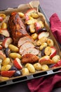 Pork baked with vegetables on a tray