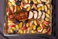 Pork baked with vegetables on a tray