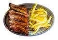 Pork barbeque ribs with french fries served with ketchup