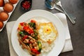 Pork basil leaves with fried egg on a plate of white rice and fr Royalty Free Stock Photo