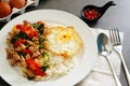 Pork basil leaves with fried egg on a plate of white rice and fr Royalty Free Stock Photo