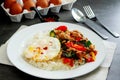 Pork basil leaves with fried egg on a plate of white rice and fr Royalty Free Stock Photo