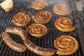 Pork And Beef Sausages Cooking Over The Hot Coals on Barbeque Grill