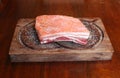 Pork belly raw and salted on a wooden tray Royalty Free Stock Photo