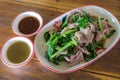 Pork boil and vegetable with spicy source. Thai food.