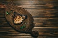 Pork bone steak on a wooden background with honey. Board slate. kenza, pepper