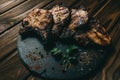 Pork bone steak on a wooden background with honey. Board slate. kenza, pepper Royalty Free Stock Photo