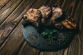 Pork bone steak on a wooden background with honey. Board slate. kenza, pepper Royalty Free Stock Photo