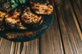 Pork bone steak on a wooden background with honey. Board slate. kenza, pepper