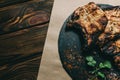 Pork bone steak on a wooden background with honey. Board slate. kenza, pepper Royalty Free Stock Photo