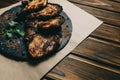 Pork bone steak on a wooden background with honey. Board slate. kenza, pepper Royalty Free Stock Photo