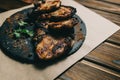 Pork bone steak on a wooden background with honey. Board slate. kenza, pepper Royalty Free Stock Photo