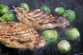 Pork and brussels sprouts on grill pan. Selective focus Royalty Free Stock Photo