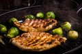 Pork and brussels sprouts on grill pan. Selective focus. Toned Royalty Free Stock Photo