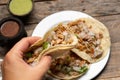 Pork carnitas tacos on wooden background. Mexican food