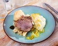 Pork cheeks with stewed cabbage leaves