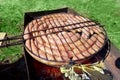 Pork and chicken sausages. Cooking on barbecue chargrill, brazier. Top view, closeup. Outdoors. Fast food. Preparation of sausages Royalty Free Stock Photo