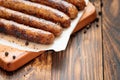 Pork chipolata. Close-up view of fried sausages. Meat dish