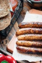 Pork chipolata. Close-up view of fried sausages. Meat dish