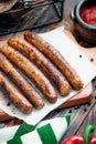 Pork chipolata. Close-up view of fried sausages. Meat dish