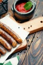 Pork chipolata. Close-up view of fried sausages. Meat dish