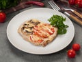 pork chop with mushrooms and tomatoes decorated with herbs Royalty Free Stock Photo