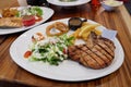 Pork chop with new potatoes, vegetables and gravy. Royalty Free Stock Photo