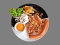 Pork Chop Steak with Grilled Chicken, Sausage, French Fries and Royalty Free Stock Photo