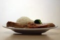 Pork Chop Steak white rice and green broccoli in the dish on the wooden table. Royalty Free Stock Photo